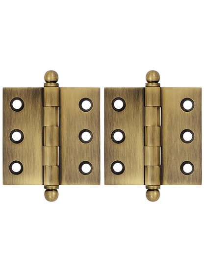 Pair of 2 inch x 2 inch Cabinet Hinges in Antique Brass.